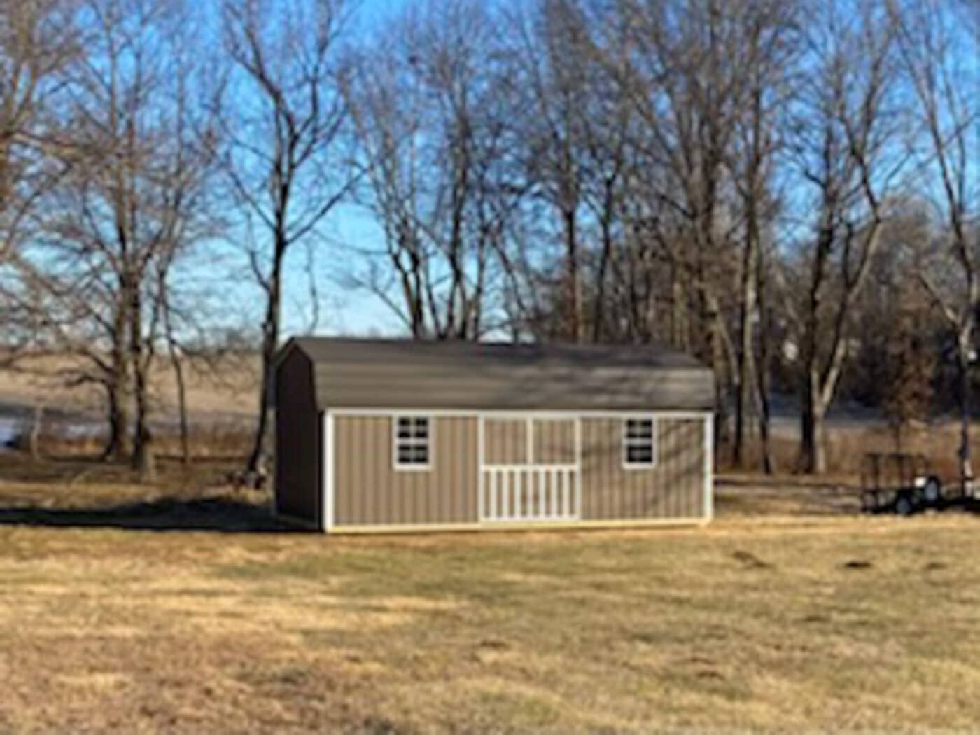 tan lofted barn supplied by ozark premier buildings