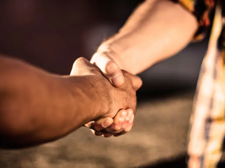 a picture of two people shaking hands