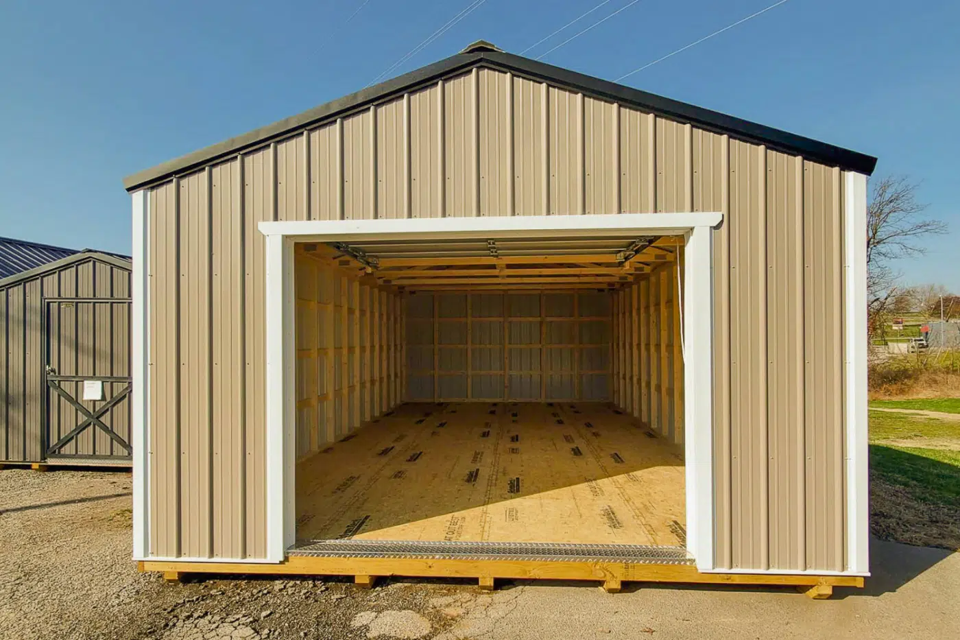 Metal and wood-sided portable garages