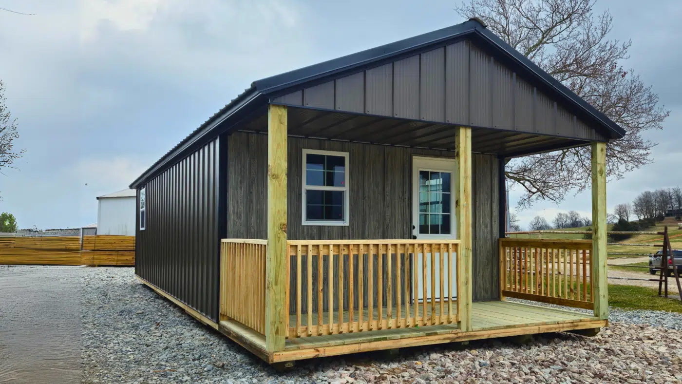 Sweet Escape cabin shell with gambrel roof and covered porch