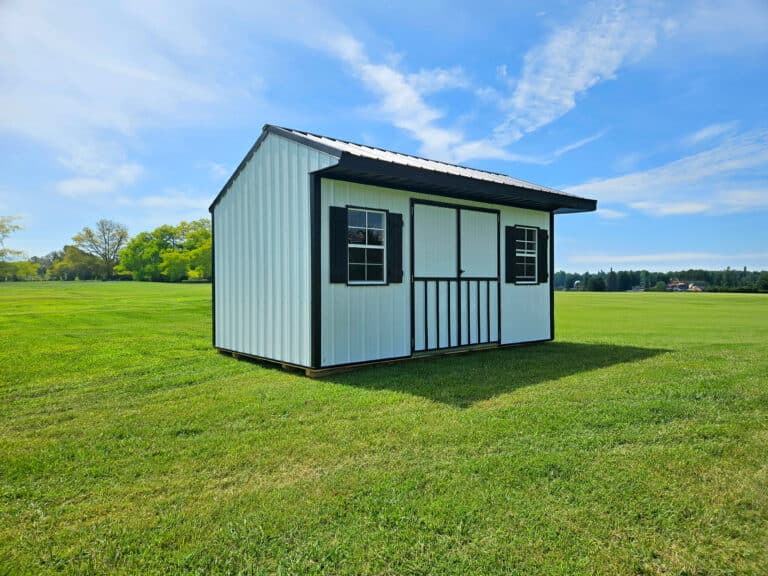 A shed with white metal siding and roofing for sale in Fayetteville, AR.