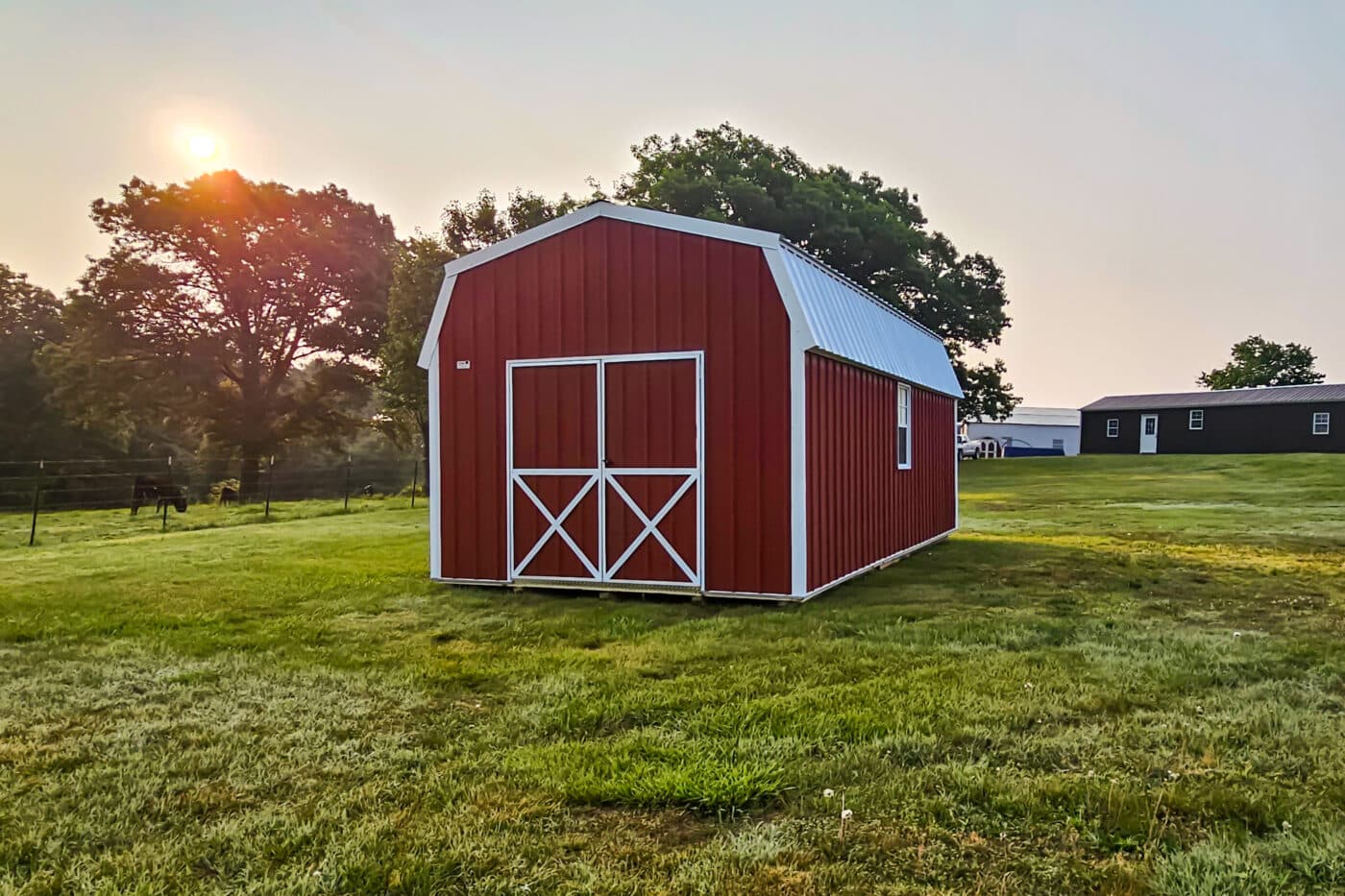 Quality barn shed in a field in the evening